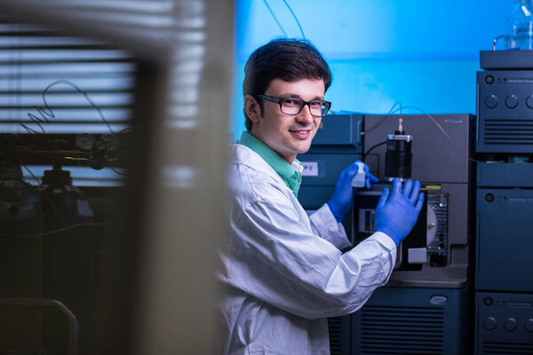 Portrait of a male researcher carrying out scientific research in a lab