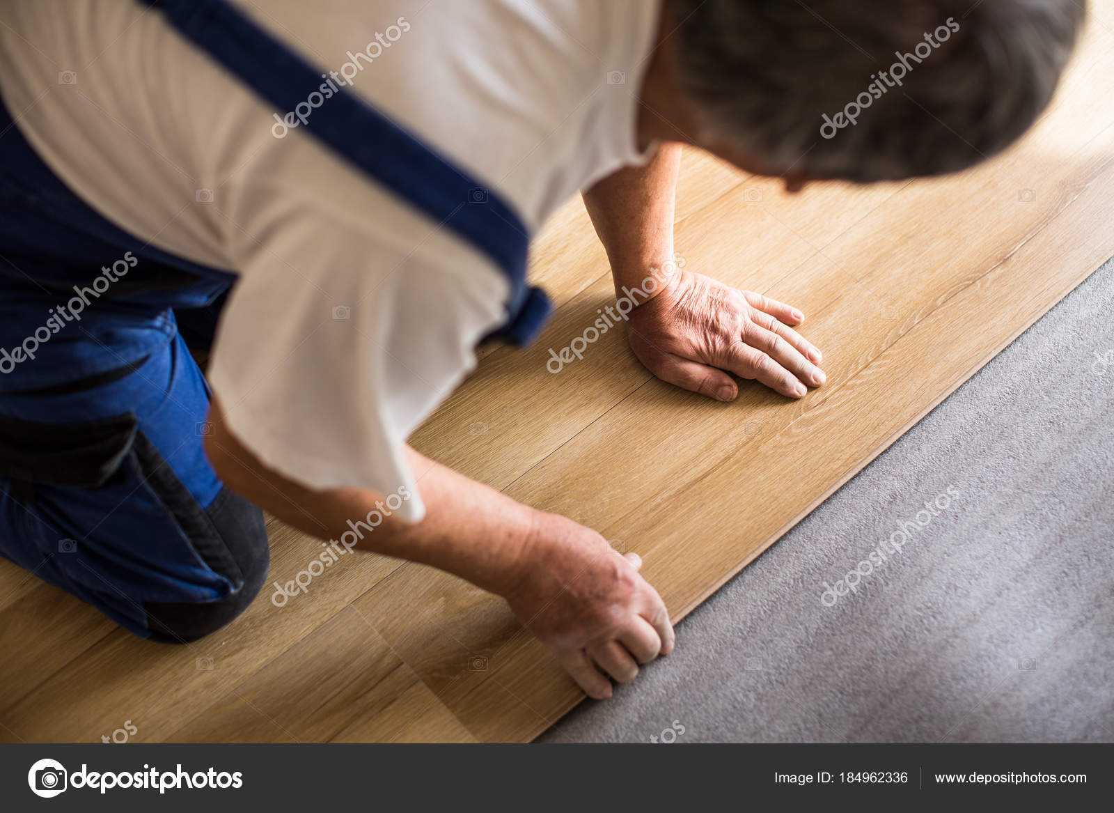 Close Up Of Male Hands Lying Parquet Floor Board Laminate Flooring Close Up Of Male Hands Lying Parquet Floor Board Laminate Flooring Stock Photo