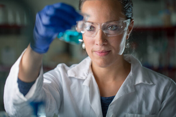 Female researcher carrying out scientific research in a lab 