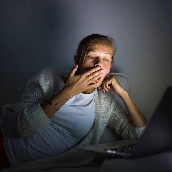 Very tired young woman, burning the midnigh oil — Stock Photo, Image