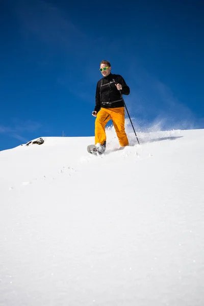 Winter Sports Young Man Running Snowshoes Downhill High Mountains Covered — Stock Photo, Image