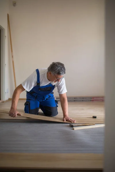 Diy Repair Building Home Concept Senior Landlord Lying Parquet Floor — Stock Photo, Image