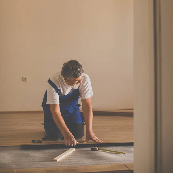 Diy Repair Building Home Concept Senior Man Lying Parquet Floor — Stock Photo, Image