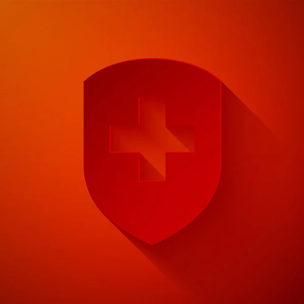 Paper cut Medical shield with cross icon isolated on red background. Protection, safety, password security. Paper art style. Vector Illustration — Stock Vector