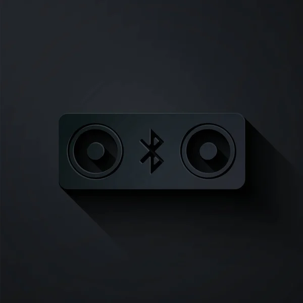 Papier découpé Bluetooth haut-parleurs icône isolée sur fond noir. Haut-parleur stéréo Bluetooth. Style art du papier. Illustration vectorielle — Image vectorielle