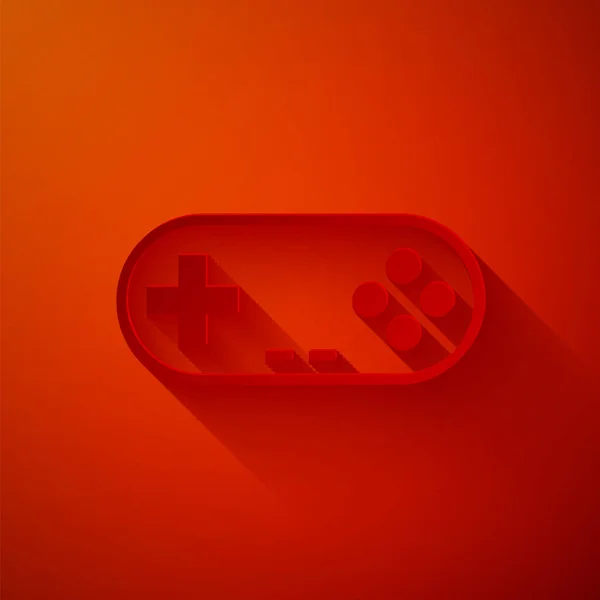 Řez papíru ikona Gamepad izolované na červeném pozadí. Herní ovladač. Papírový styl. Vektorová ilustrace — Stockový vektor