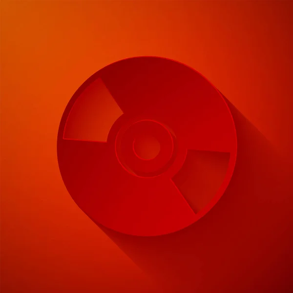 Значок диска CD или DVD вырезанный бумагой изолирован на красном фоне. Знак компакт-диска. Бумажный стиль. Векторная миграция — стоковый вектор