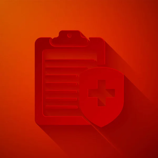 Papírvágódeszka, piros alapon izolált egészségbiztosítási ikonnal. Betegvédelem. Írólap és pajzs kereszttel. Papírművészeti stílus. Vektorillusztráció — Stock Vector