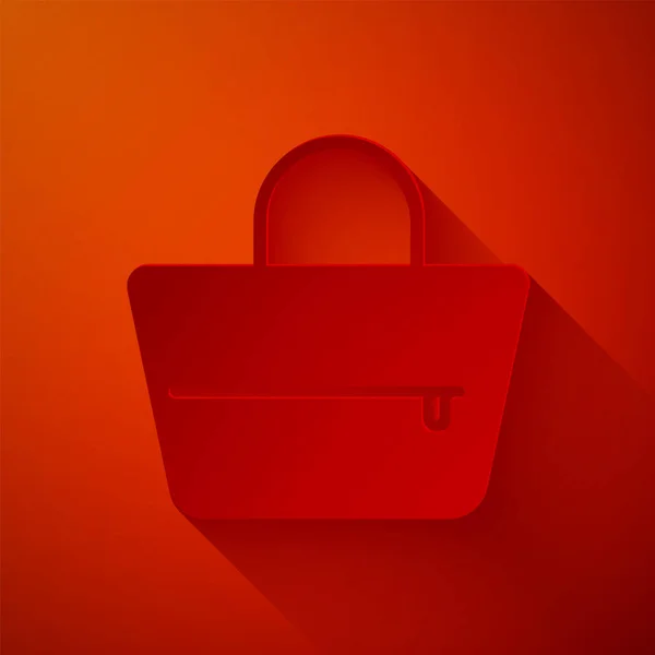 Pappersklipp Handväska ikon isolerad på röd bakgrund. Kvinnlig handväska tecken. Glamour casual baggage symbol. Papperskonst. Vektor Illustration — Stock vektor