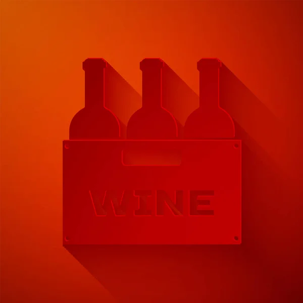 Corte de papel Botellas de vino en una caja de madera icono aislado sobre fondo rojo. Botellas de vino en un icono de caja de madera. Estilo de arte de papel. Ilustración vectorial — Vector de stock