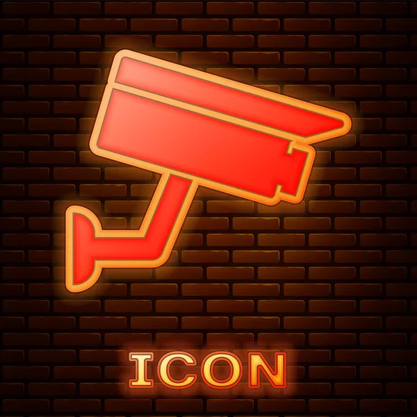 Lumineux néon Caméra de sécurité icône isolée sur fond de mur de briques. Illustration vectorielle — Image vectorielle