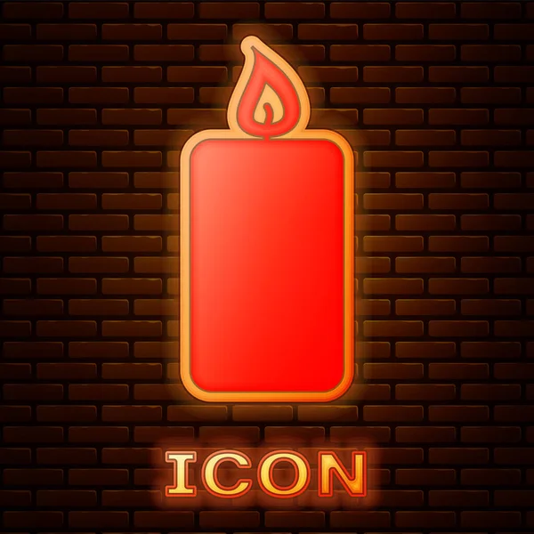 Glowing neon Burning candle icon isolated on brick wall background. Old fashioned lit candle. Cylindrical aromatic candle stick with burning flame. Vector Illustration — Stock Vector