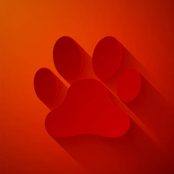 Papier gesneden Paw print icoon geïsoleerd op rode achtergrond. Afdruk van honden- of kattenpootjes. Dierenspoor. Papierkunst stijl. Vector Illustratie — Stockvector