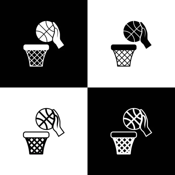 Set Mano con pelota de baloncesto e icono de canasta aislada sobre fondo blanco y negro. Pelota en el aro de baloncesto. Ilustración vectorial — Archivo Imágenes Vectoriales