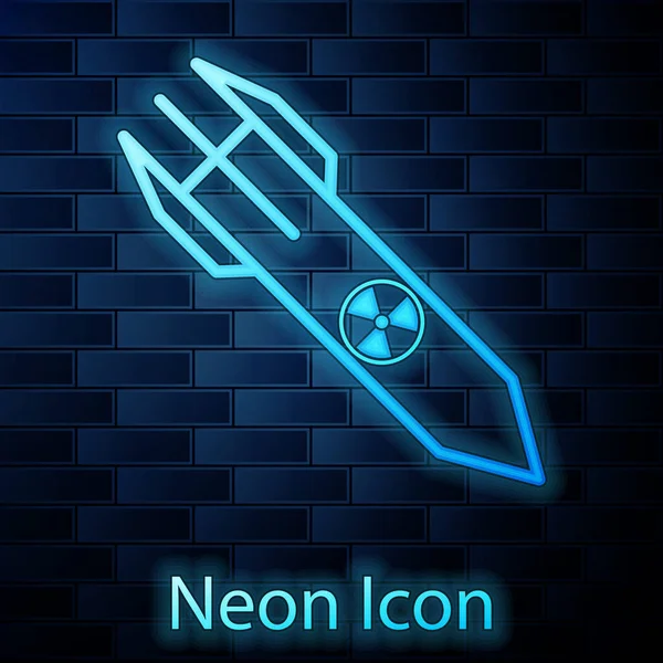 Icono de cohete nuclear de neón brillante aislado en el fondo de la pared de ladrillo. Bomba cohete vuela hacia abajo. Ilustración vectorial — Vector de stock