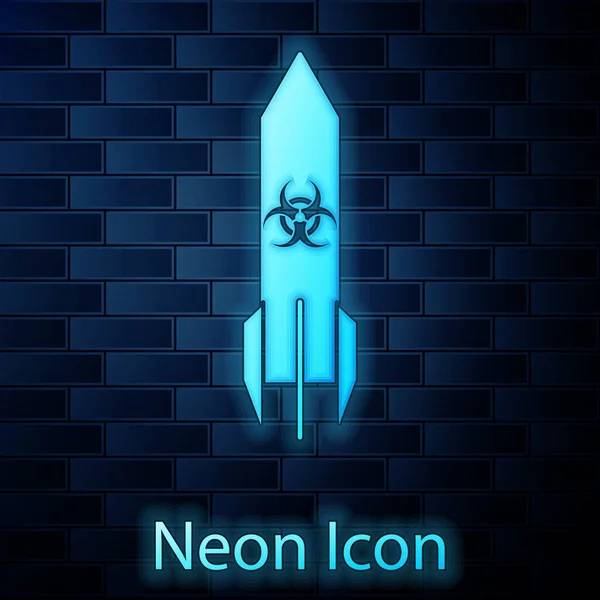 Glödande neon Biohazard raket ikon isolerad på tegel vägg bakgrund. Rocket bomb flyger ner. Vektor Illustration — Stock vektor