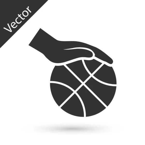 Серый Рука с баскетбольным мячом значок изолирован на белом фоне. Спортивный символ. Векторная миграция — стоковый вектор