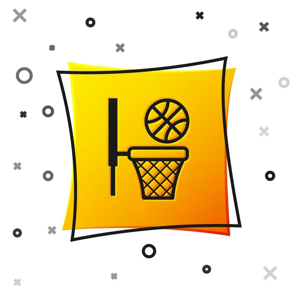 Baloncesto negro y canasta icono aislado sobre fondo blanco. Pelota en el aro de baloncesto. Botón cuadrado amarillo. Ilustración vectorial — Vector de stock