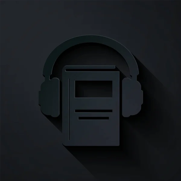 Corte de papel Icono de libro de audio aislado sobre fondo negro. Reserva con auriculares. Signo de audio guía. Concepto de aprendizaje en línea. Estilo de arte de papel. Ilustración vectorial — Archivo Imágenes Vectoriales