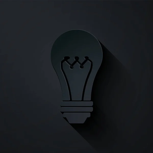 Corte de papel Icono de bombilla aislado sobre fondo negro. Símbolo de energía e idea. Lámpara eléctrica. Estilo de arte de papel. Ilustración vectorial — Vector de stock