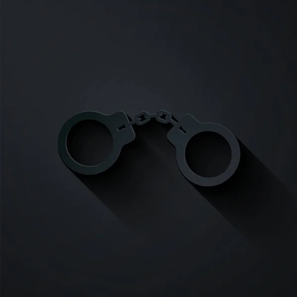 Papel corte Handcuffs ícone isolado no fundo preto. Estilo de arte de papel. Ilustração vetorial — Vetor de Stock