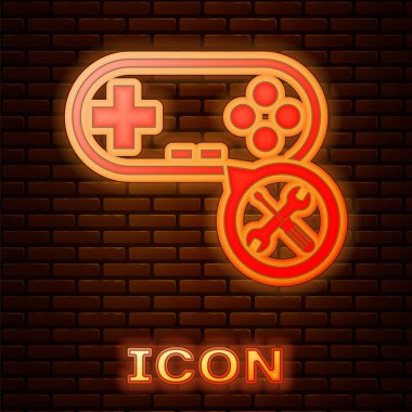 Tuğla duvar arka planda izole tornavida ve anahtar simgesi ile parlayan Neon gamepad. Ayarlama, hizmet, ayarlama, bakım, onarım, sabitleme. Vektör Illustration