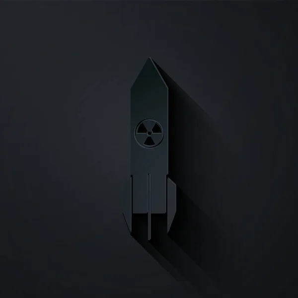 Papier wyciąć Nuklearna ikona rakiety izolowane na czarnym tle. Bomba rakietowa spada. Papier w stylu sztuki. Ilustracja wektora — Wektor stockowy