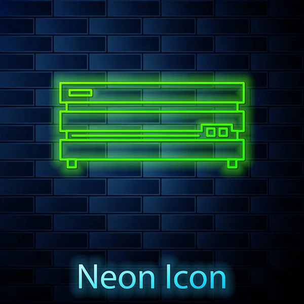Светящаяся неоновая линия иконка игровой приставки, выделенная на фоне кирпичной стены. Векторная миграция — стоковый вектор