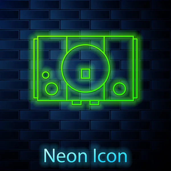 Leuchtende Neon-Line-Videospielkonsolen-Symbol isoliert auf Ziegelwand Hintergrund. Vektorillustration — Stockvektor