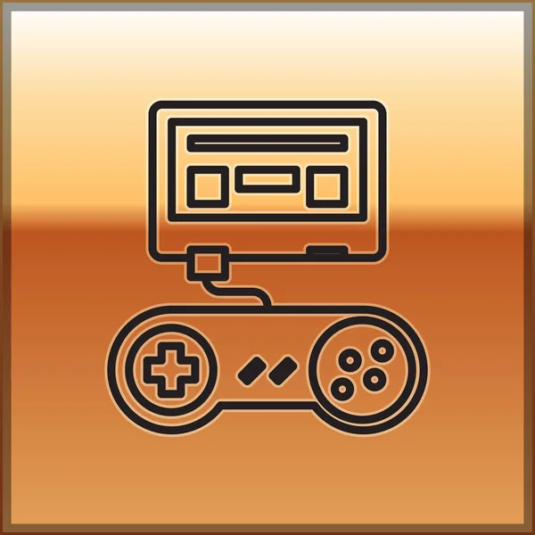 Línea negra Videoconsola con icono de joystick aislado sobre fondo dorado. Ilustración vectorial — Vector de stock