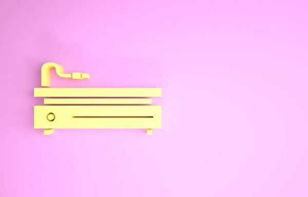 Жовта піктограма відеоігрової консолі ізольована на рожевому фоні. Концепція мінімалізму. 3D ілюстрація 3D рендеринга — стокове фото