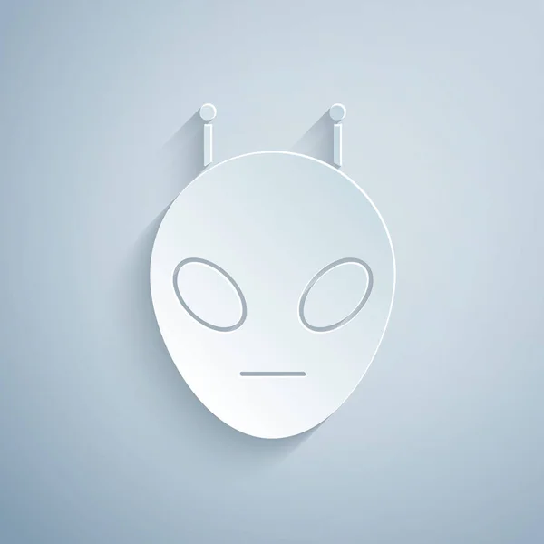 Carta tagliata icona aliena isolata su sfondo grigio. Faccia aliena extraterrestre o simbolo della testa. Stile cartaceo. Illustrazione vettoriale — Vettoriale Stock
