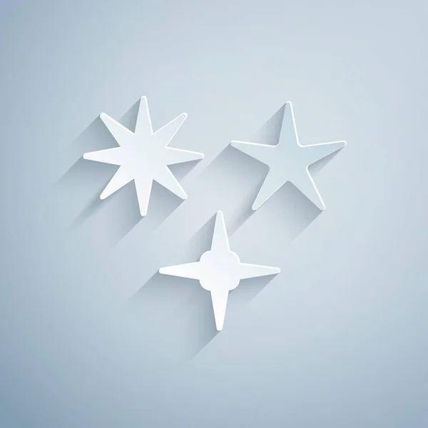 Paper cut Falling star icon isolated on grey background. Meteoroid, meteorite, comet, asteroid, star icon. Paper art style. Vector Illustration — Stock Vector