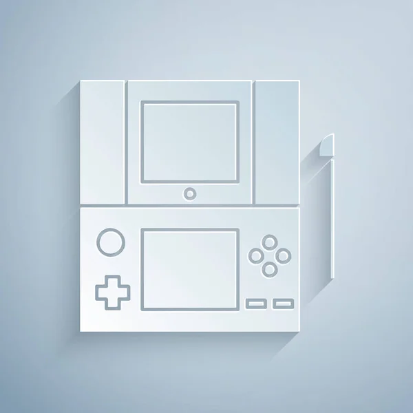 Corte de papel Icono de consola de videojuegos portátil aislado sobre fondo gris. Señal de mando. Concepto de juego. Estilo de arte de papel. Ilustración vectorial — Archivo Imágenes Vectoriales