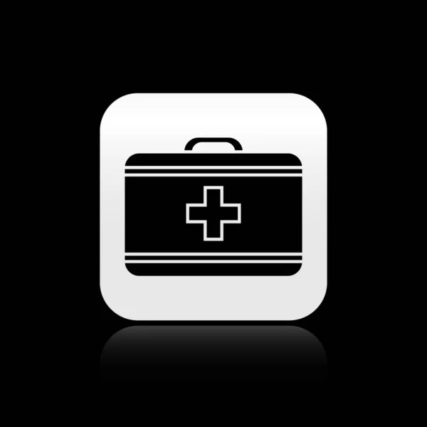 Icono del kit de primeros auxilios negro aislado sobre fondo negro. Caja médica con cruz. Equipo médico para emergencias. Concepto de salud. Botón cuadrado plateado. Ilustración vectorial — Vector de stock