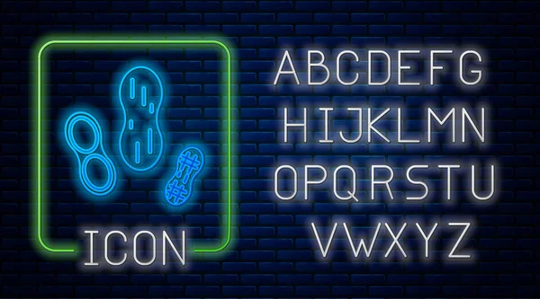 Сяючий неоновий арахісовий значок ізольований на фоні цегляної стіни. Неоновий легкий алфавіт. Векторна ілюстрація — стоковий вектор
