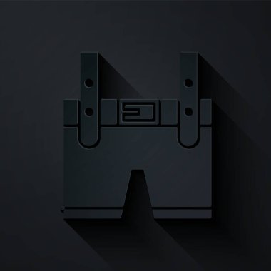 Kağıt kesiği Lederhosen simgesi siyah arkaplanda izole edilmiş. Geleneksel Bavyera kıyafetleri. Oktoberfest kıyafeti. Pantolon ve pantolon askısı. Patrick günü. Kağıt sanatı tarzı. Vektör İllüstrasyonu