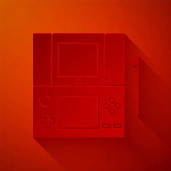 Paper cut Icône de console de jeu vidéo portable isolée sur fond rouge. Panneau de jeu. Concept de jeu. Style art du papier. Illustration vectorielle — Image vectorielle