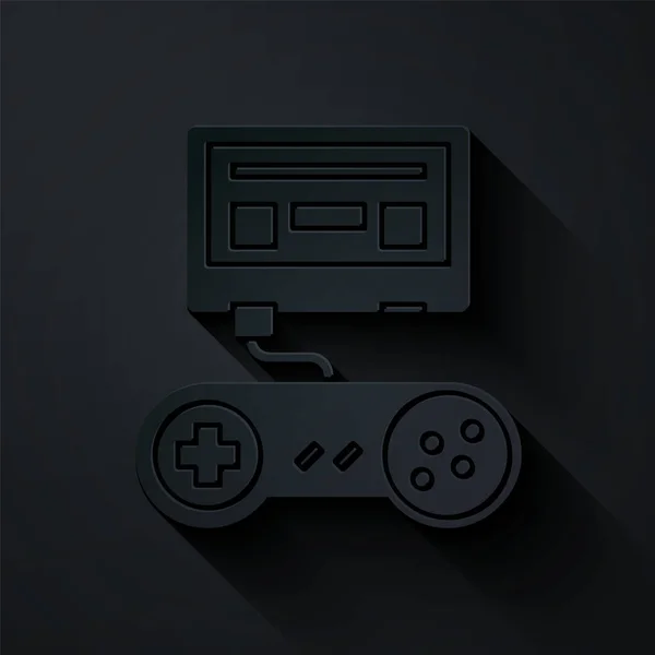 Papier découpé console de jeu vidéo avec icône joystick isolé sur fond noir. Style art du papier. Illustration vectorielle — Image vectorielle