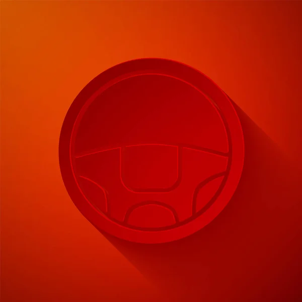 Corte de papel Icono del volante aislado sobre fondo rojo. Icono de rueda de coche. Estilo de arte de papel. Ilustración vectorial — Archivo Imágenes Vectoriales