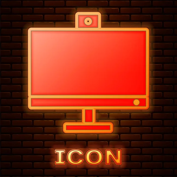 Leuchtende Neon-Computer-Monitor-Symbol isoliert auf Backsteinwand Hintergrund. PC-Komponenten-Zeichen. Vektorillustration — Stockvektor