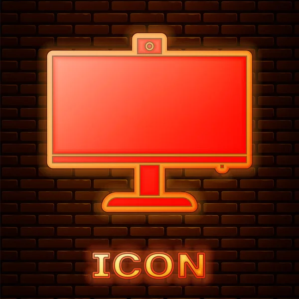 Ragyogó neon számítógép monitor ikon elszigetelt téglafal háttér. Pc alkatrész jel. Vektorillusztráció — Stock Vector