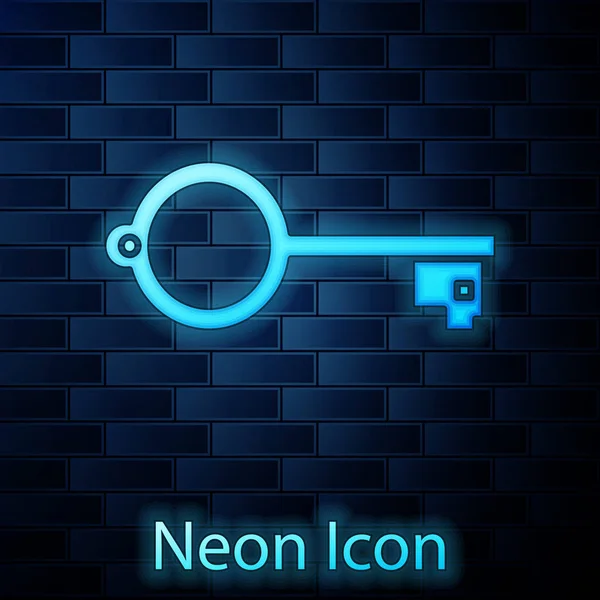 Glödande neon Ancient nyckel för spel ikon isolerad på tegelvägg bakgrund. Vektor Illustration — Stock vektor