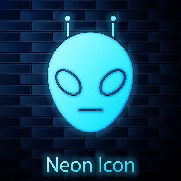 Icona luminosa al neon Alien isolata su sfondo muro di mattoni. Faccia aliena extraterrestre o simbolo della testa. Illustrazione vettoriale — Vettoriale Stock
