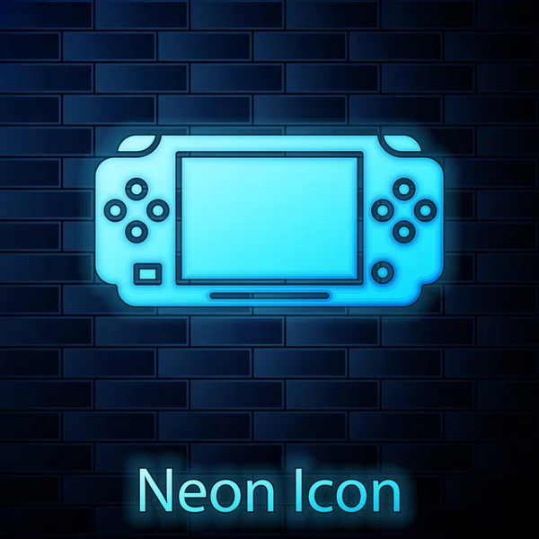 Zářící neon Přenosné video herní konzole ikona izolované na cihlové zdi pozadí. Znamení Gamepad. Herní koncept. Vektorová ilustrace — Stockový vektor