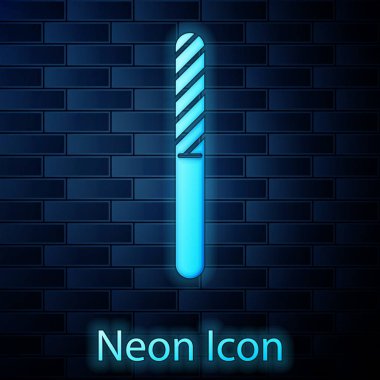 Glowing neon Nail file icon isolated on brick wall background. Manicure tool. Vector Illustration