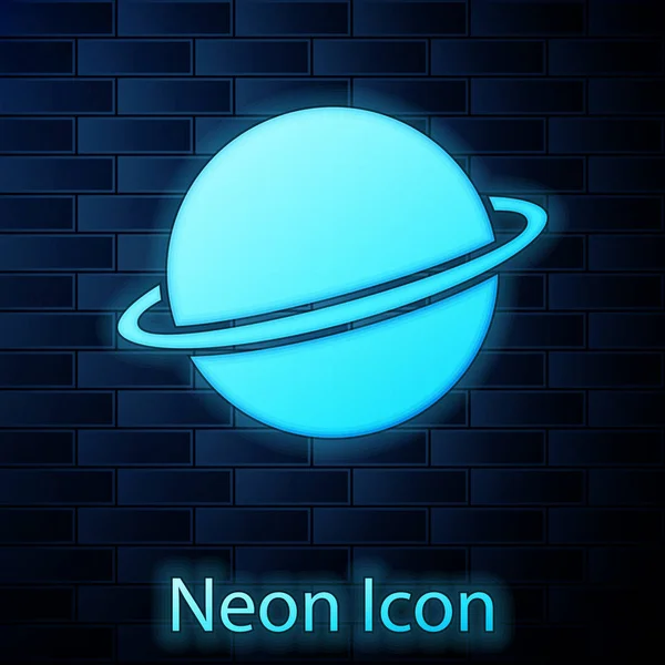 Svítící neon Planet Saturn s ikonou planetárního kroužku izolovanou na pozadí cihlové stěny. Vektorová ilustrace — Stockový vektor