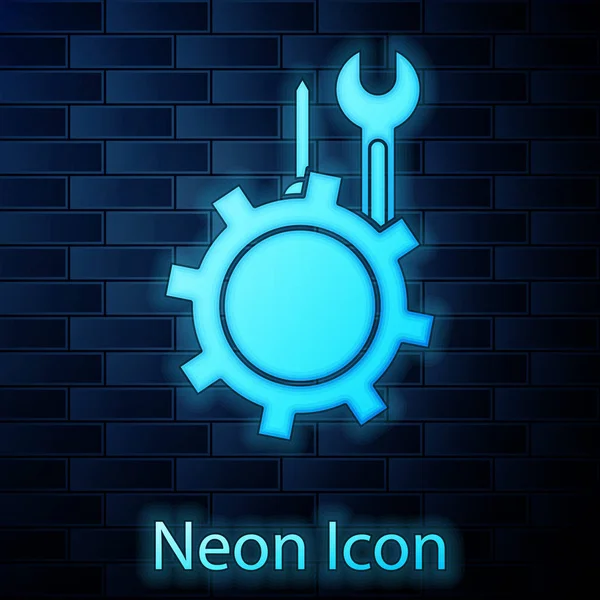 Glowing neon Wrench and screwdriver in gear icon isolated on brick wall background. Adjusting, service, setting, maintenance, repair, fixing. Vector Illustration — Stock vektor