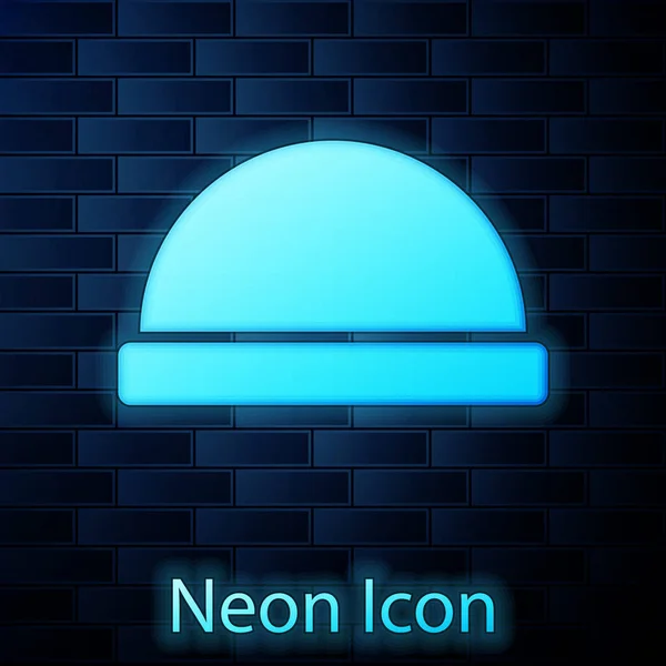 Glowing neon Beanie hat icon isolated on brick wall background. Vector Illustration — Stok Vektör