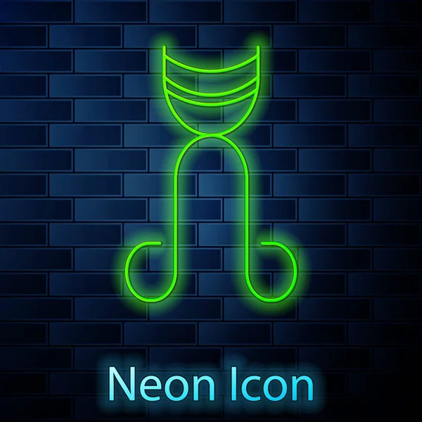 Leuchtende Neon-Linie Wimpernzange Symbol isoliert auf Backsteinwand Hintergrund. Makeup-Tool-Zeichen. Vektorillustration — Stockvektor